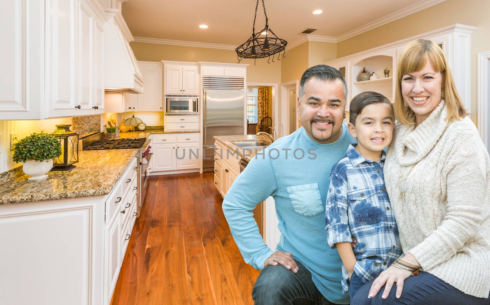 Young Mixed Race Family Having Fun in Custom Kitchen by Feverpitched