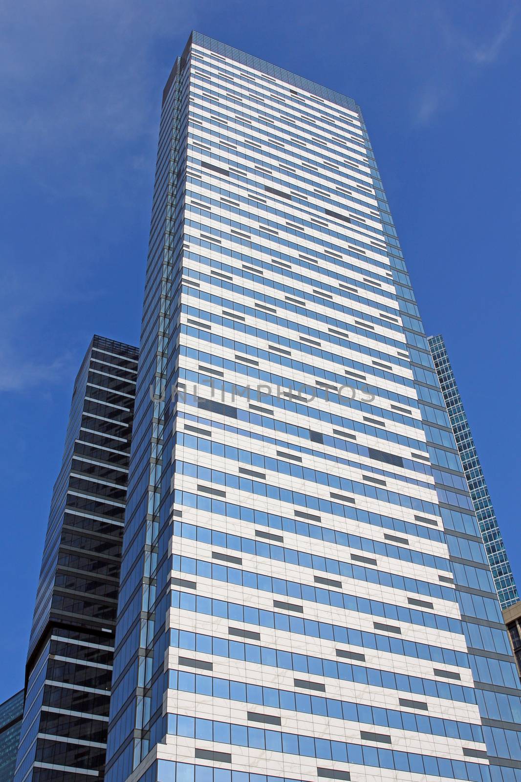 Modern buildings of glass and steel skyscrapers against the sky.