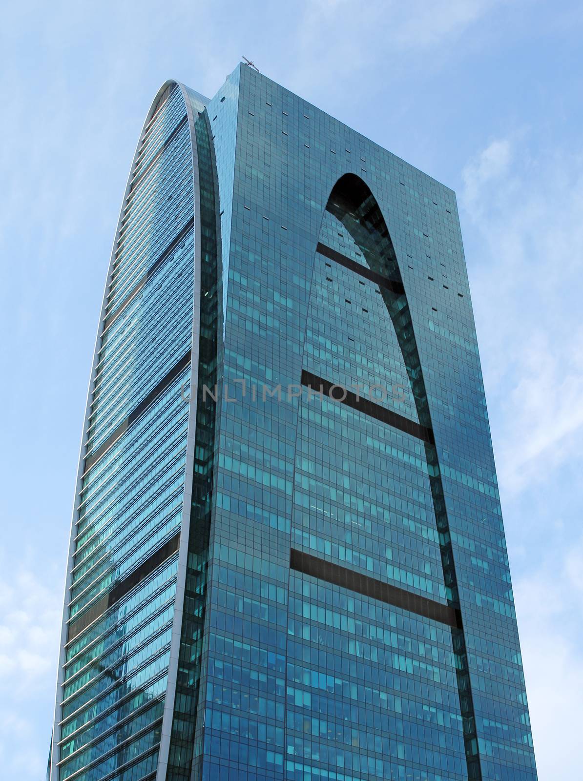 Modern buildings of glass and steel skyscrapers against the sky.