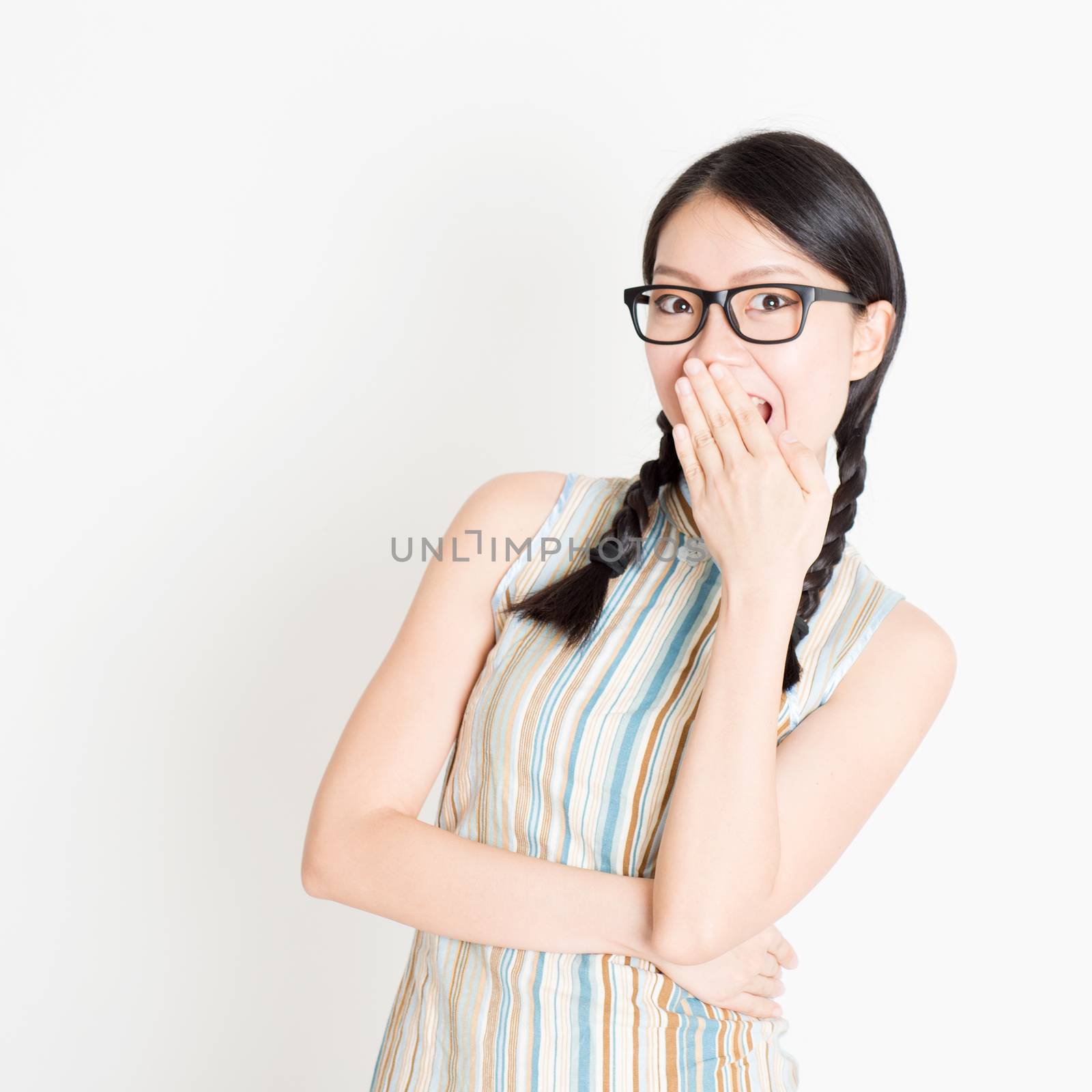 Asian woman laugh and covering mouth by szefei
