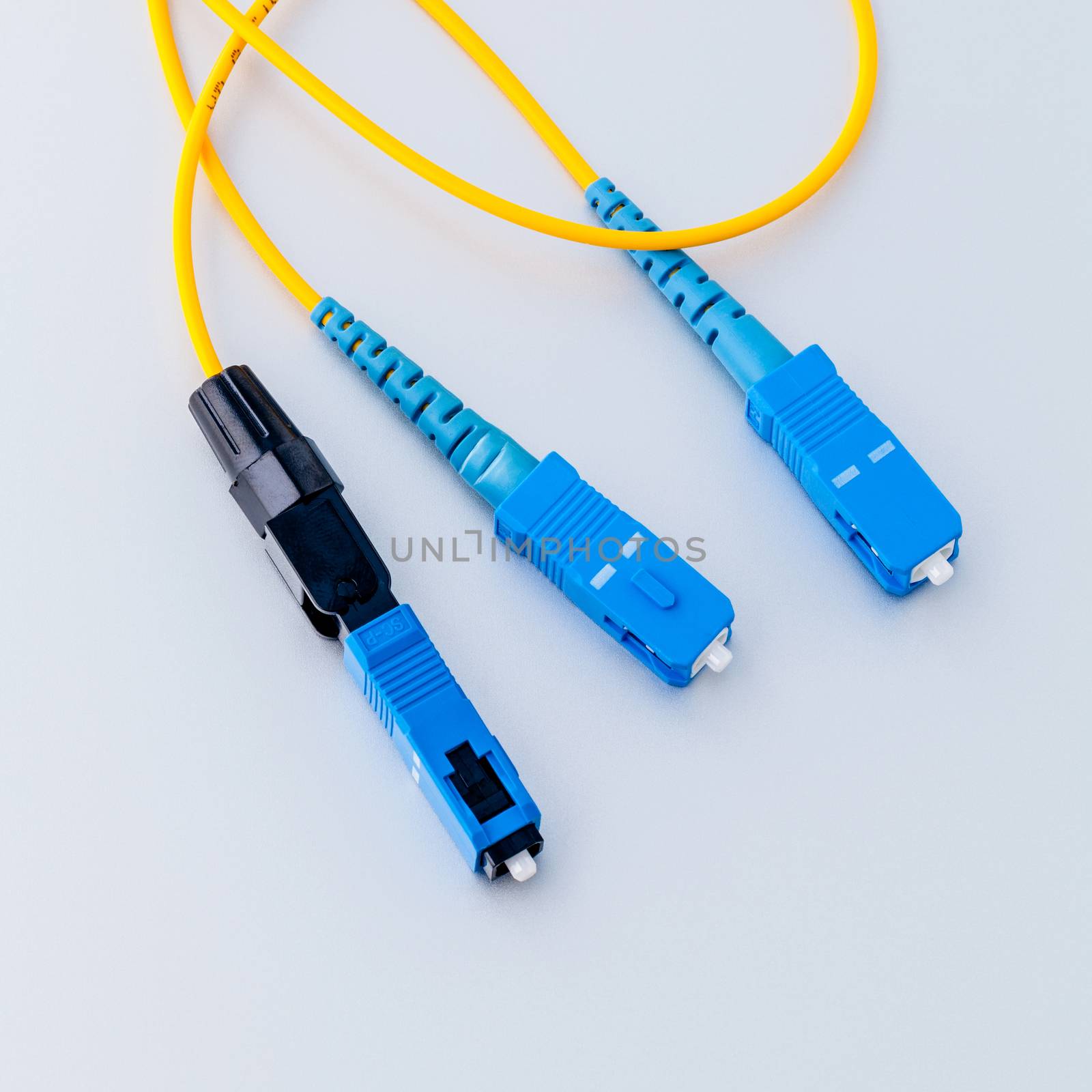 Fiber Optics connectors symbolic photo for fast internet connect by kerdkanno
