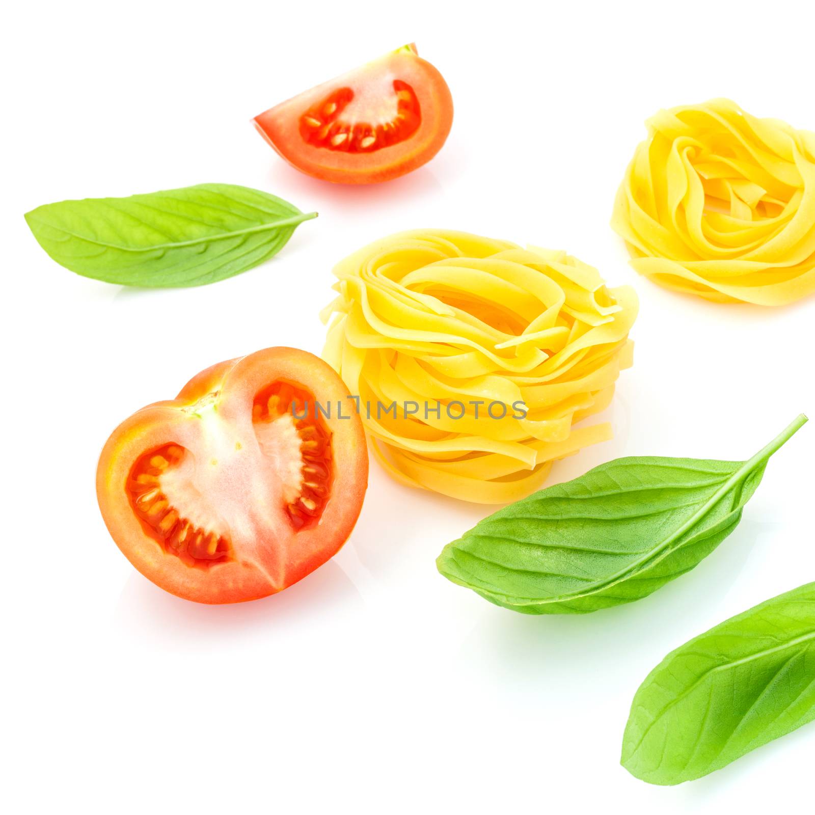 Italian food concept Fettuccine with tomato and sweet basil isolate on white background.
Fettuccine and ingradients with copy space.