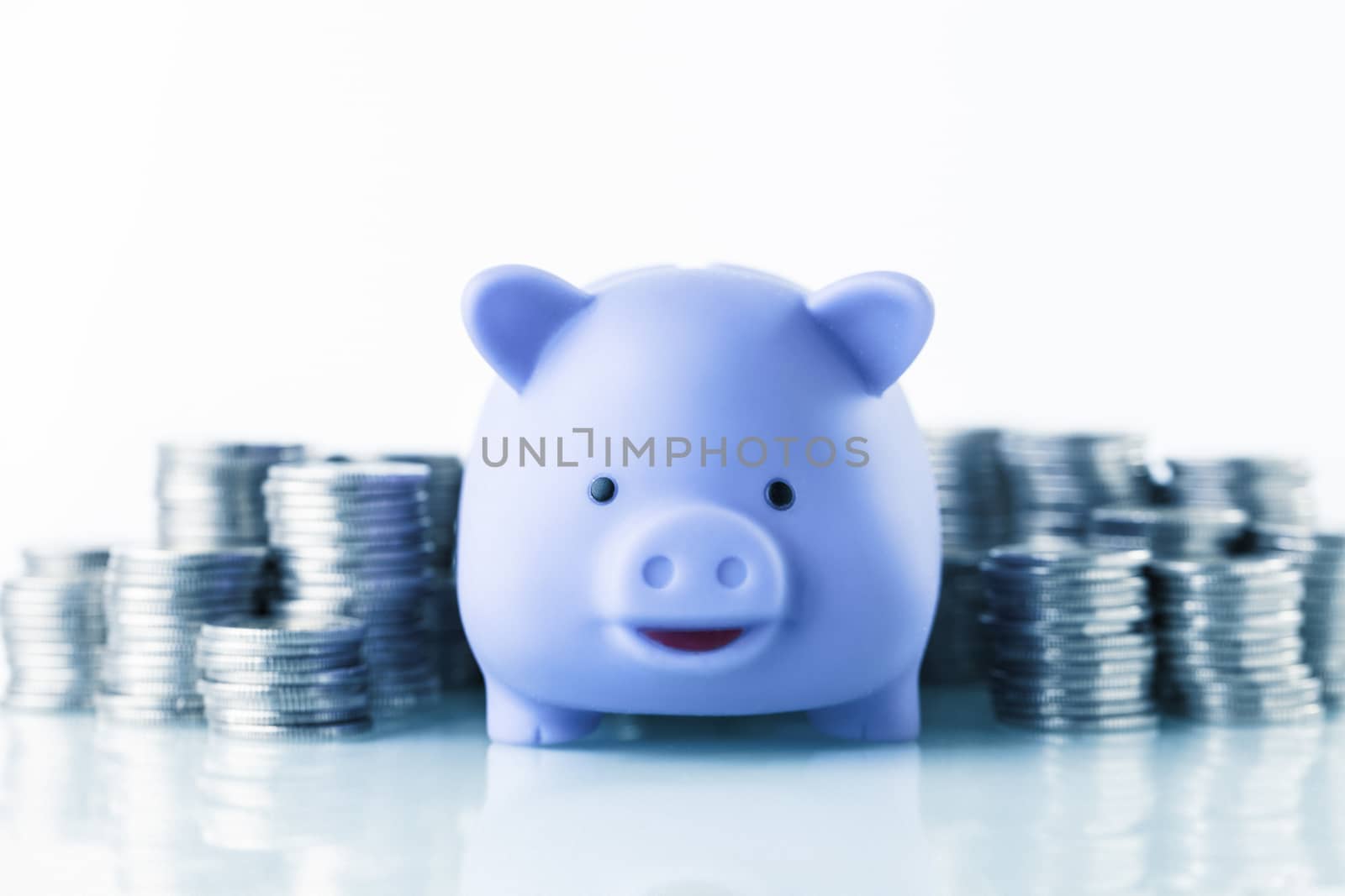 Financial concept with piggy bank, pile of money on white background