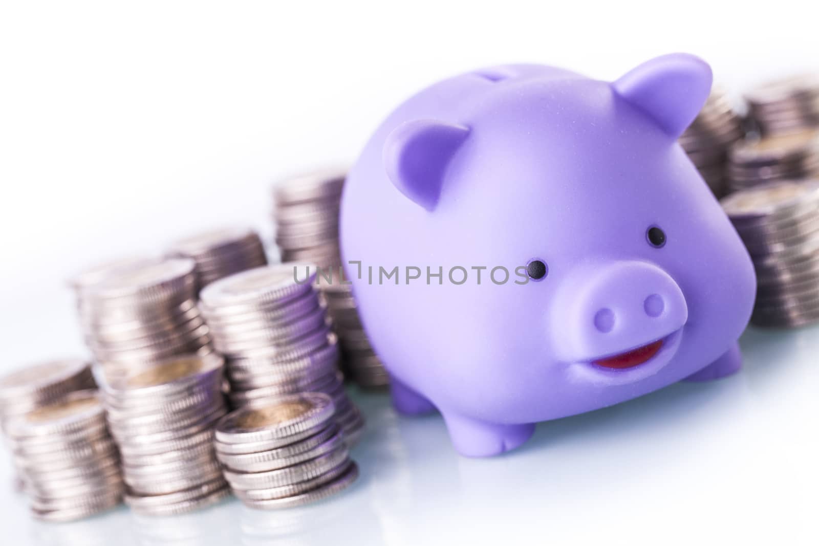 Financial concept with piggy bank, pile of money on white background