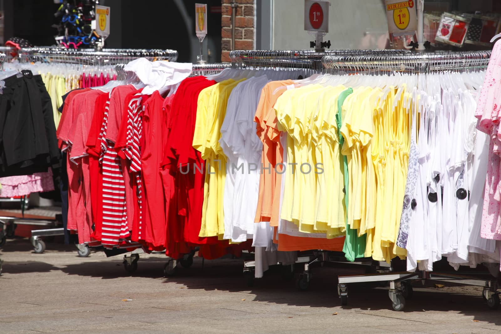 Colorful shirts on a clothes rail