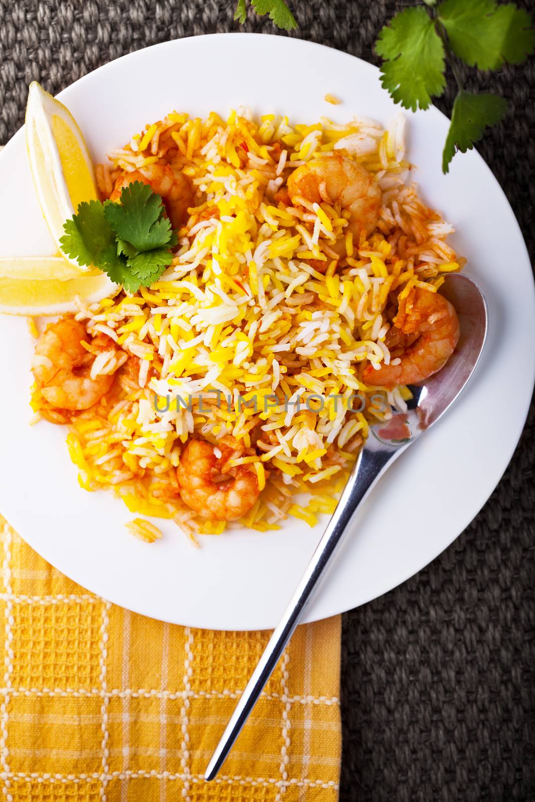 Indian Biryani with Shrimp on a white plate