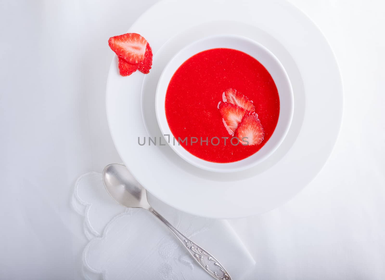 Strawberry soup with white napkin on a table