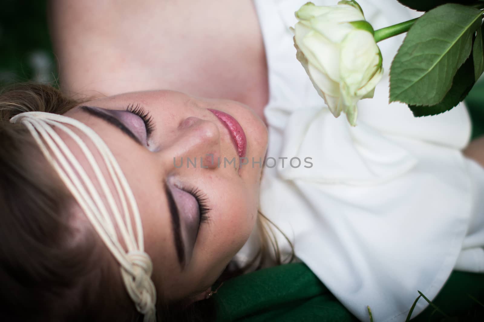 beautiful girl with a white rose in the Park