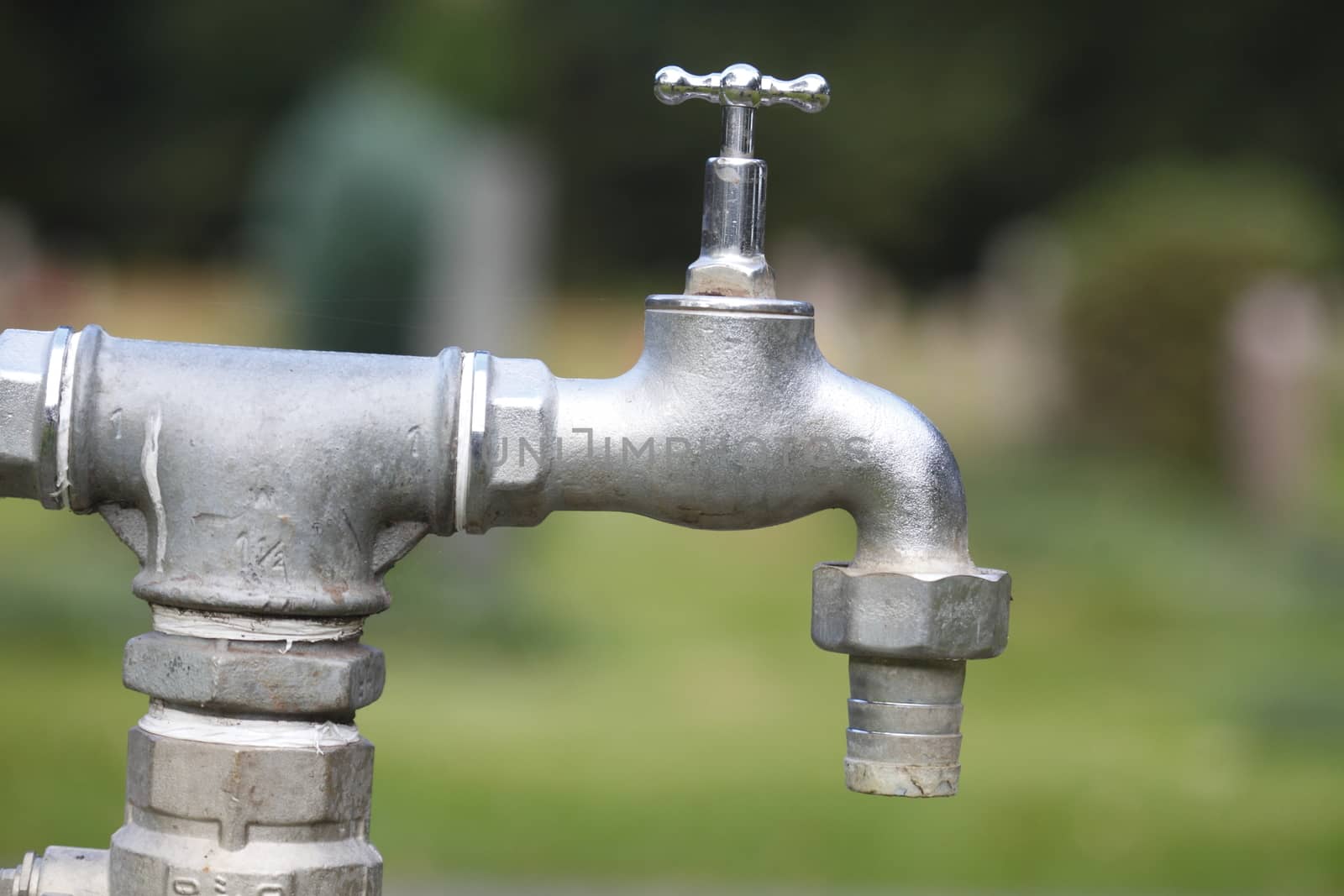 metal water tap in garden