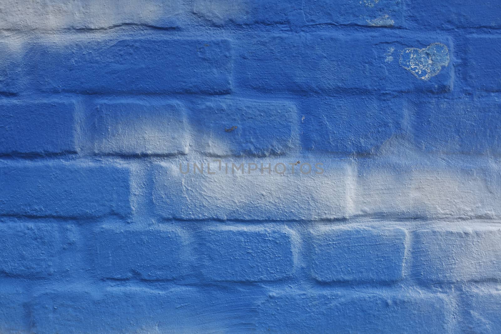 Blue and white Bricks in a Wall