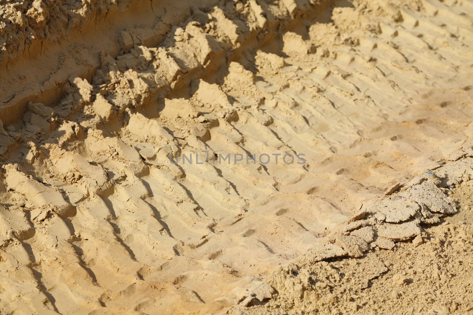 Exclavator Tracks in the  Sand