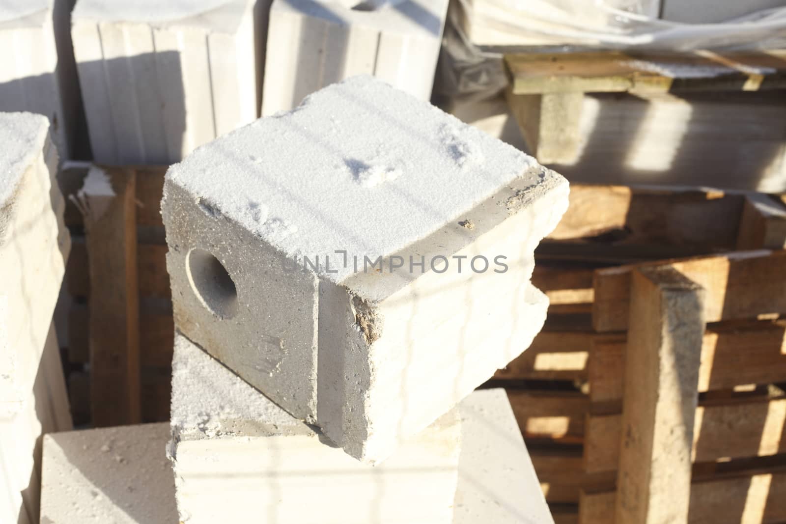 with hoarafrost coated white Building Stone on a construction site