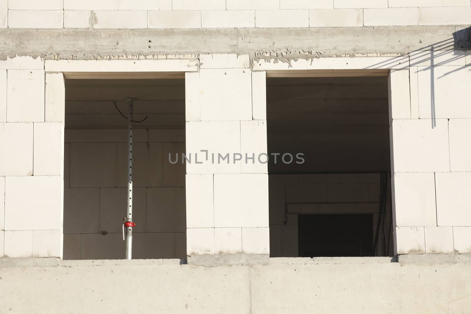 white bricks and window holes on a construction site