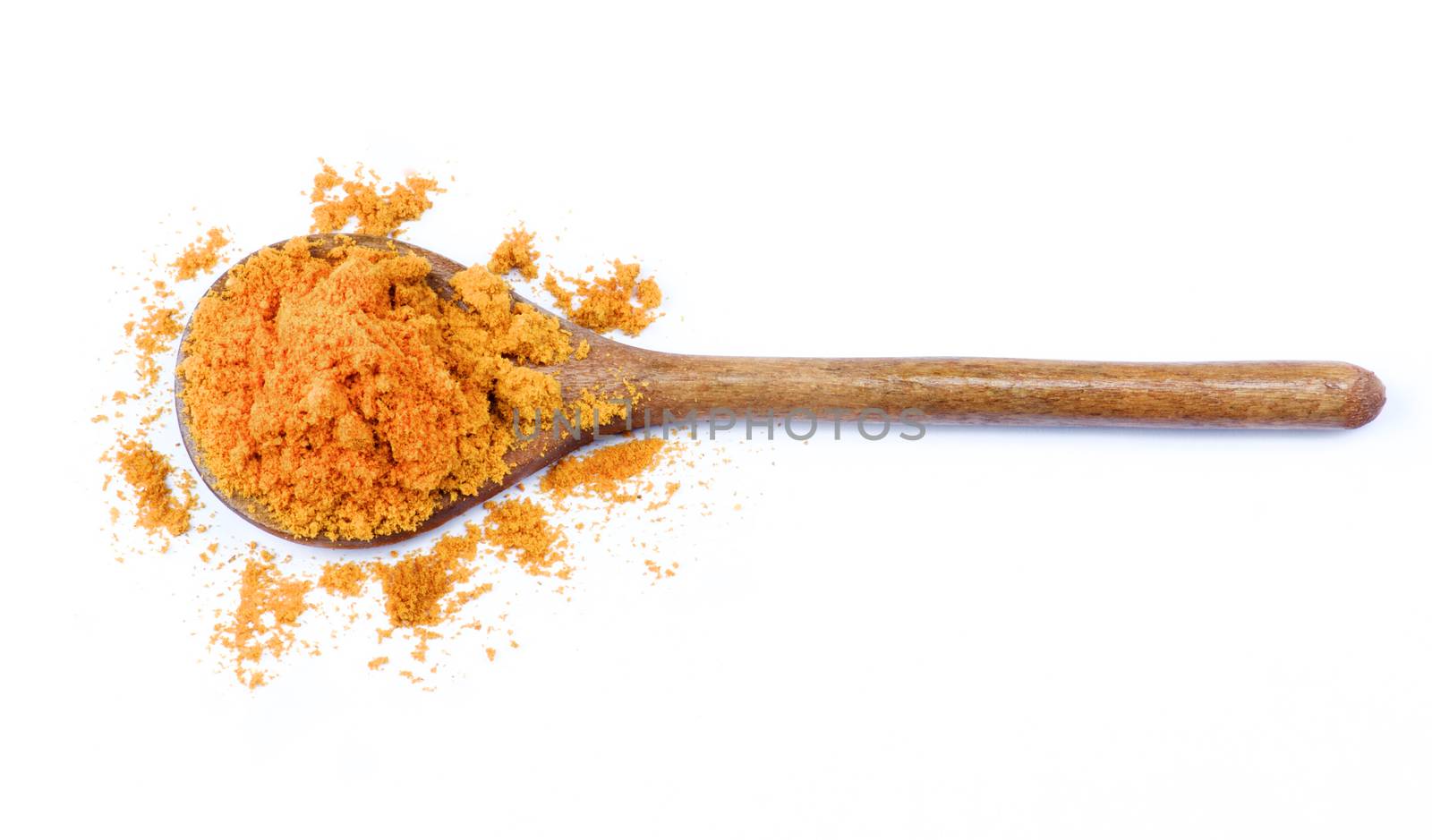 Spicy Curry Powder in Wooden Spoon isolated on White background