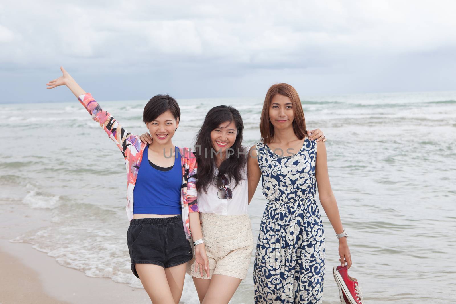 portrai of asian woman friend group relaxing cacation on sea beach with smiling and happiness face 