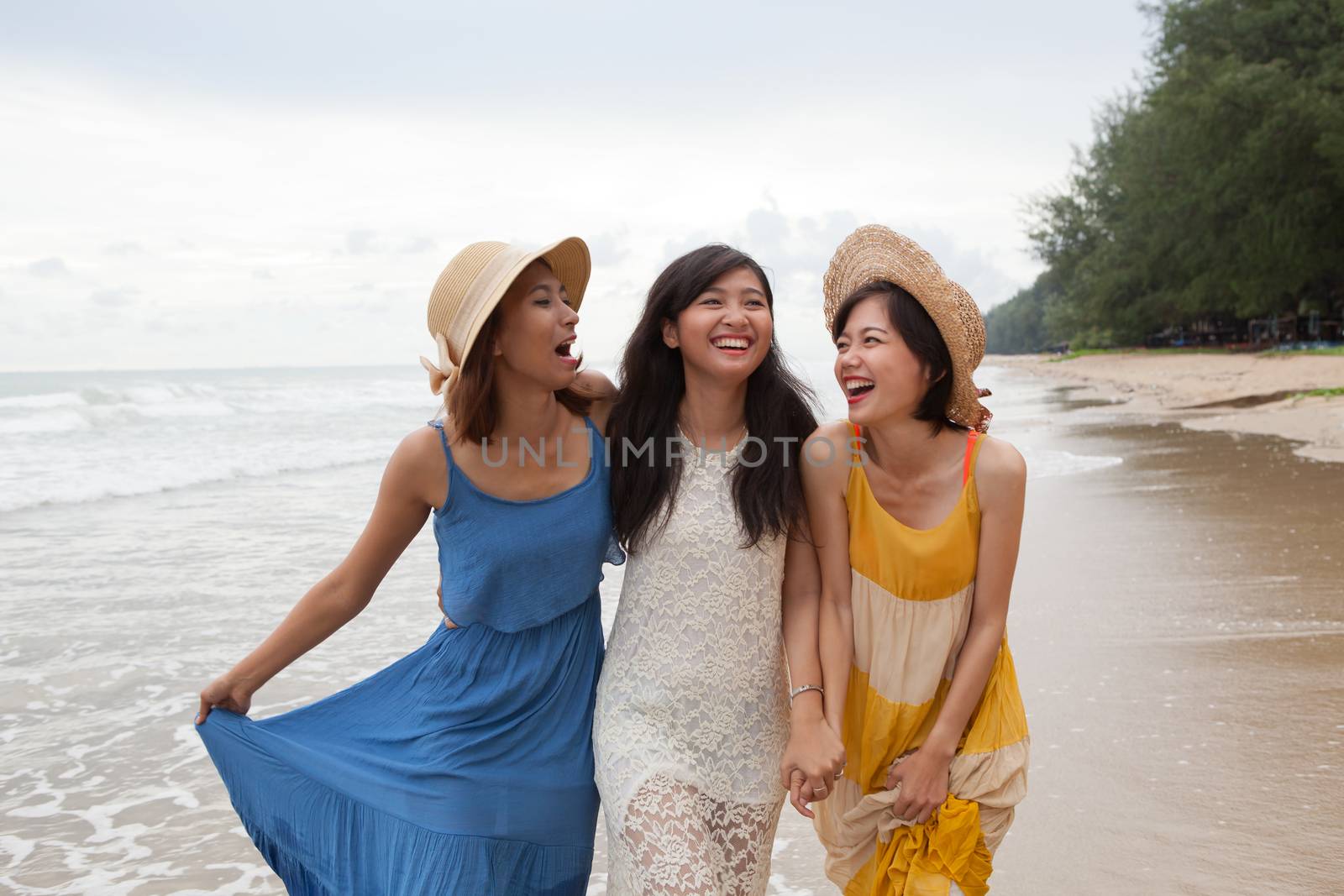 portrait of young asian woman with happiness emotion wearing bea by khunaspix
