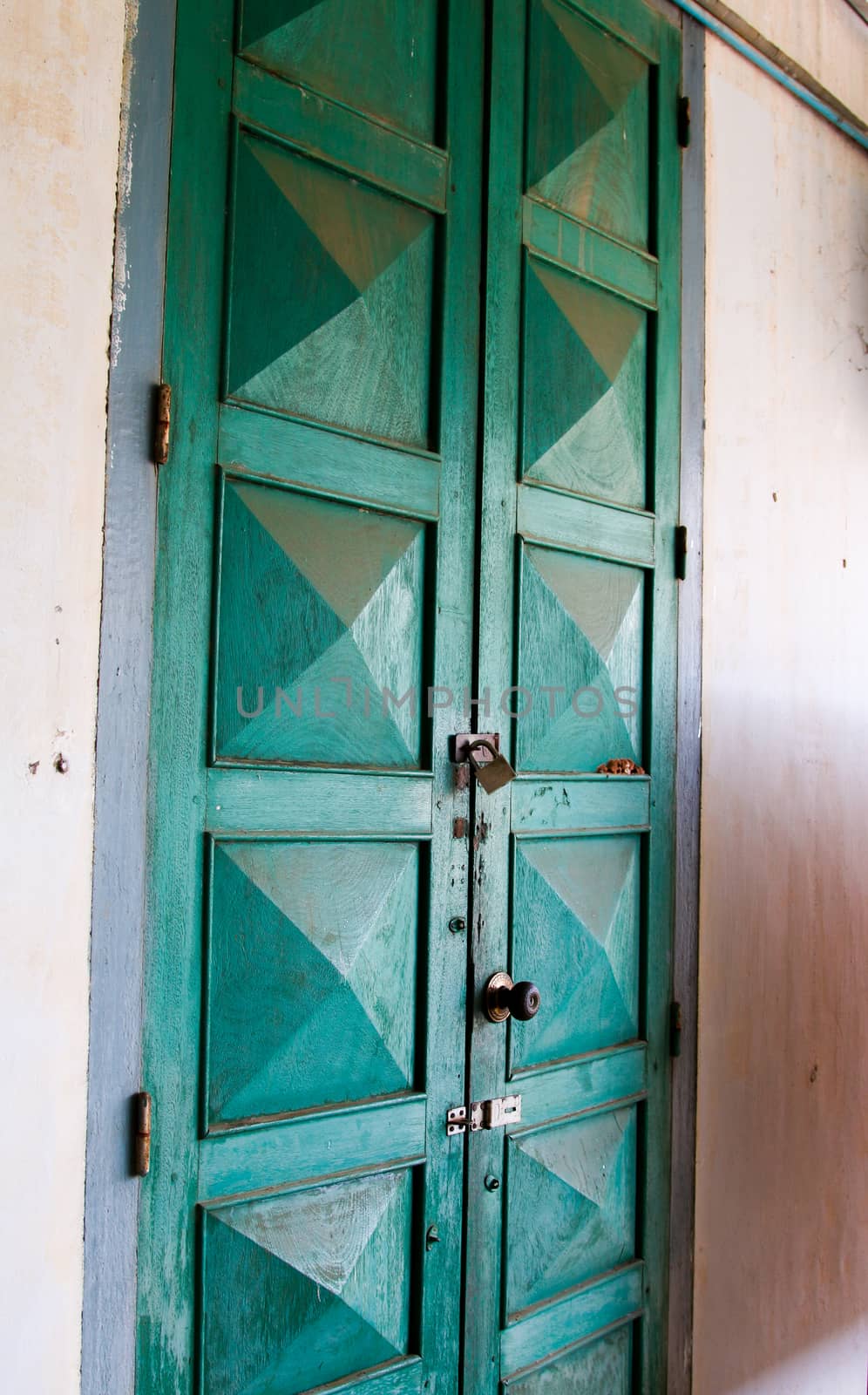 wooden Green retro door. Old architectural element. Vibrant colors. by N_u_T