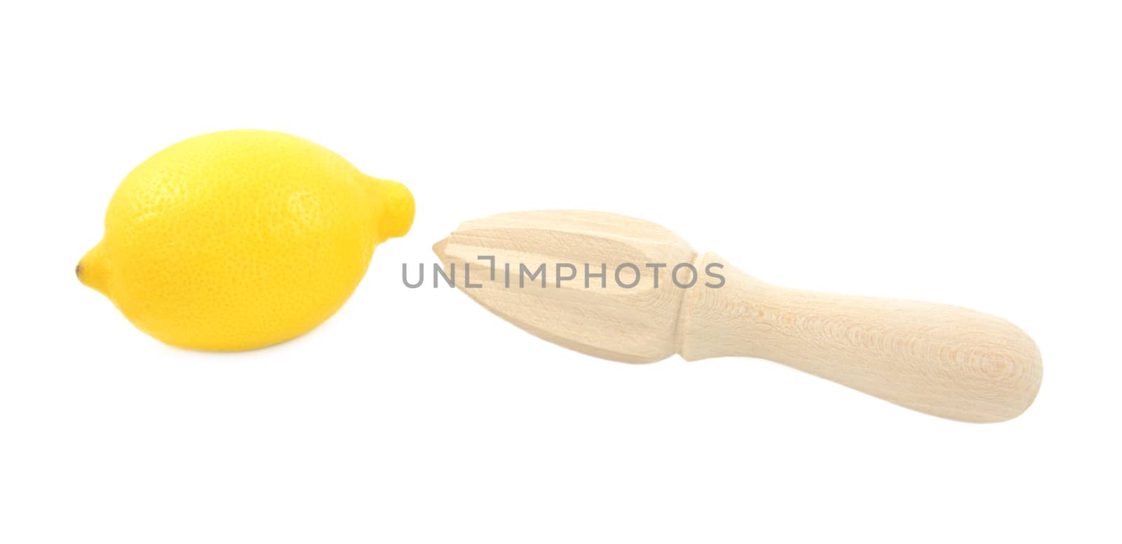 Whole lemon and wooden citrus reamer, isolated on a white background