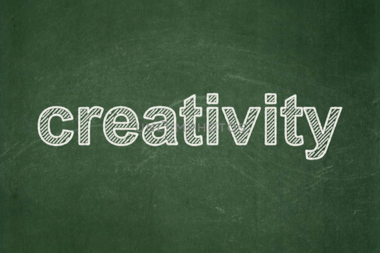 Advertising concept: text Creativity on Green chalkboard background