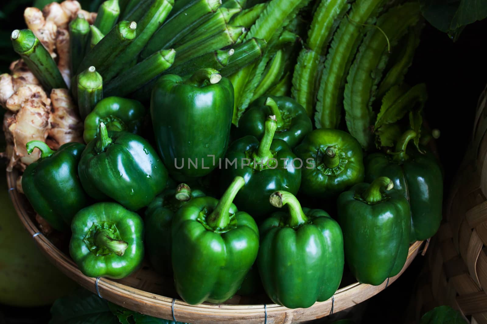 Fresh ripe bell pepper on the market by nopparats