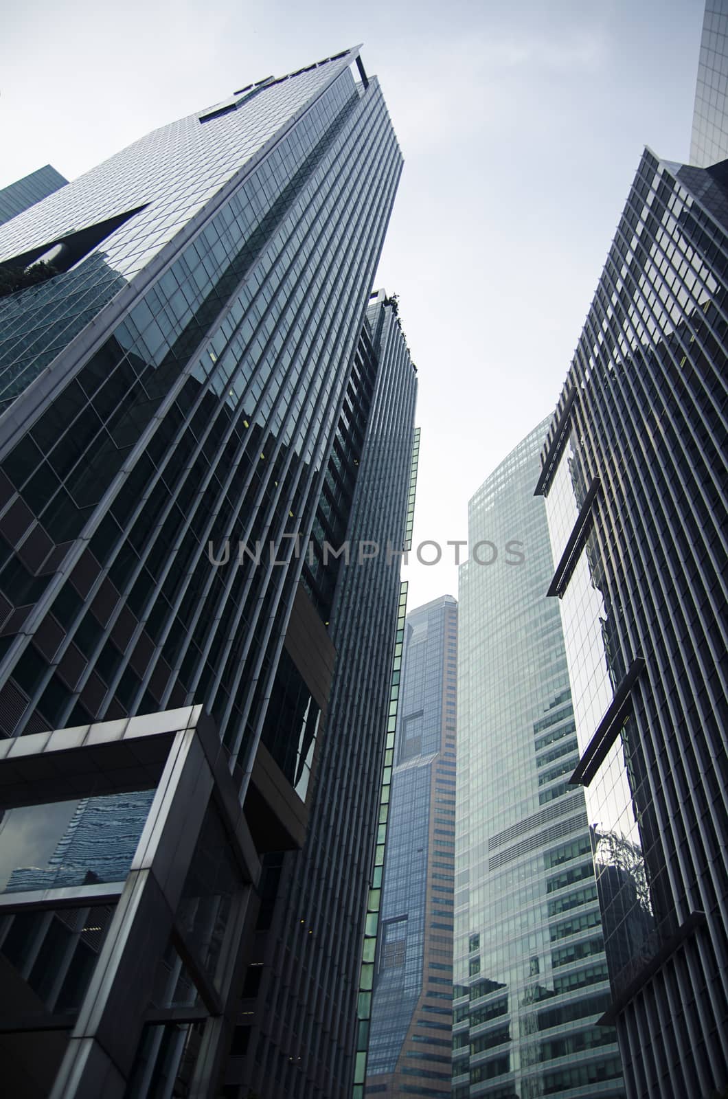 Modern transperent background perspective view to steel blue glass high rise building skyscrapers, industrial architecture