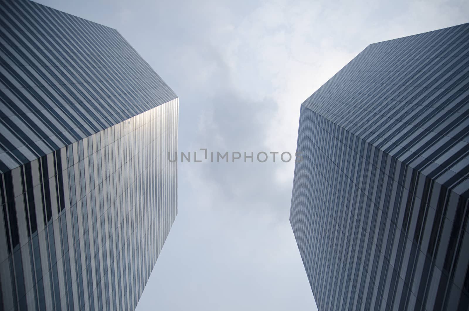 Modern transperent background perspective view to steel blue glass high rise building skyscrapers, industrial architecture