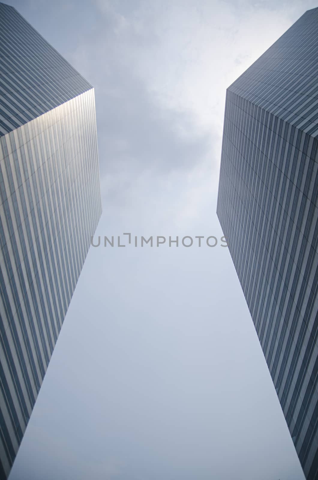 Modern transperent background perspective view to steel blue glass high rise building skyscrapers, industrial architecture