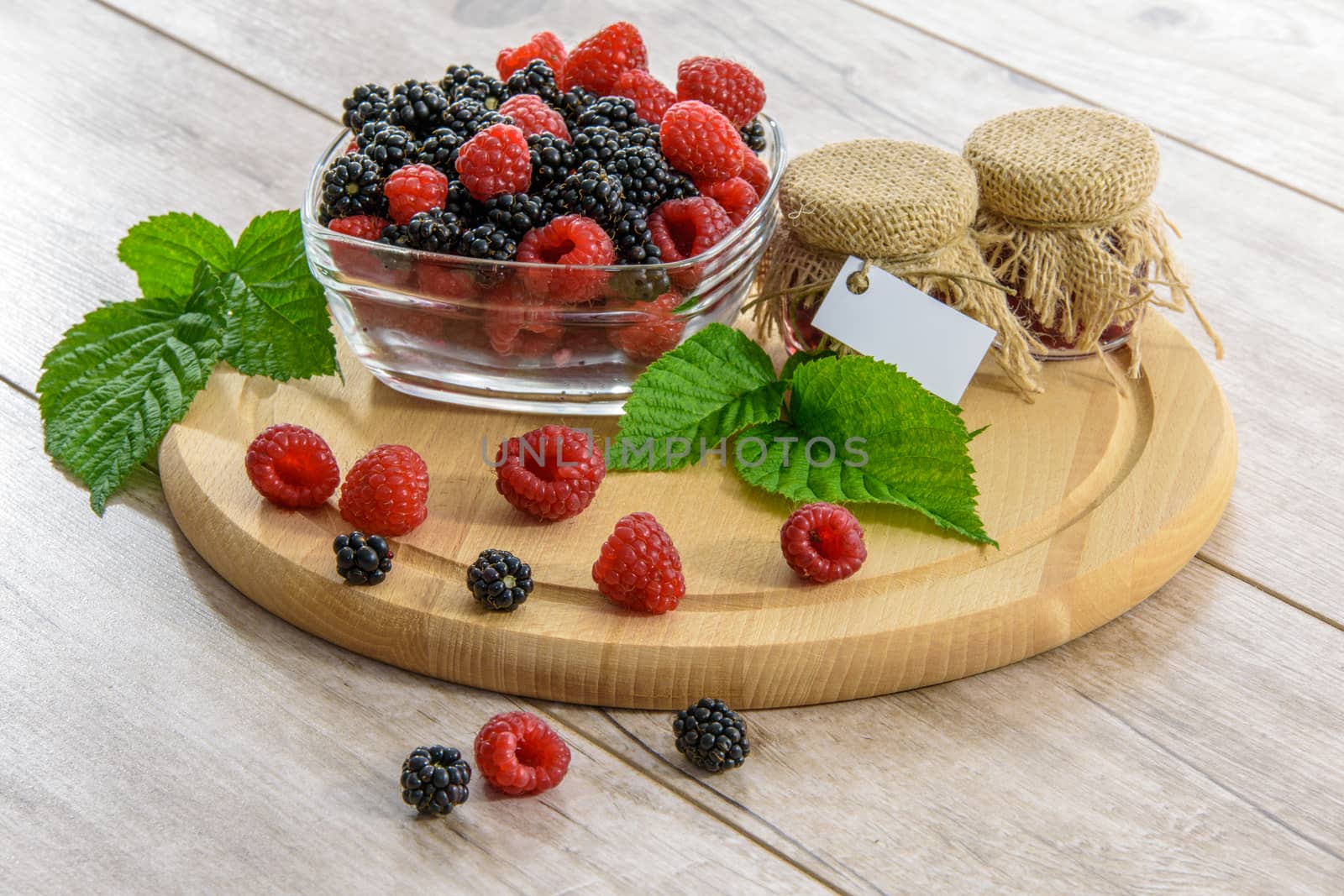 Jars of jam with fruits of the forest in vintage styling