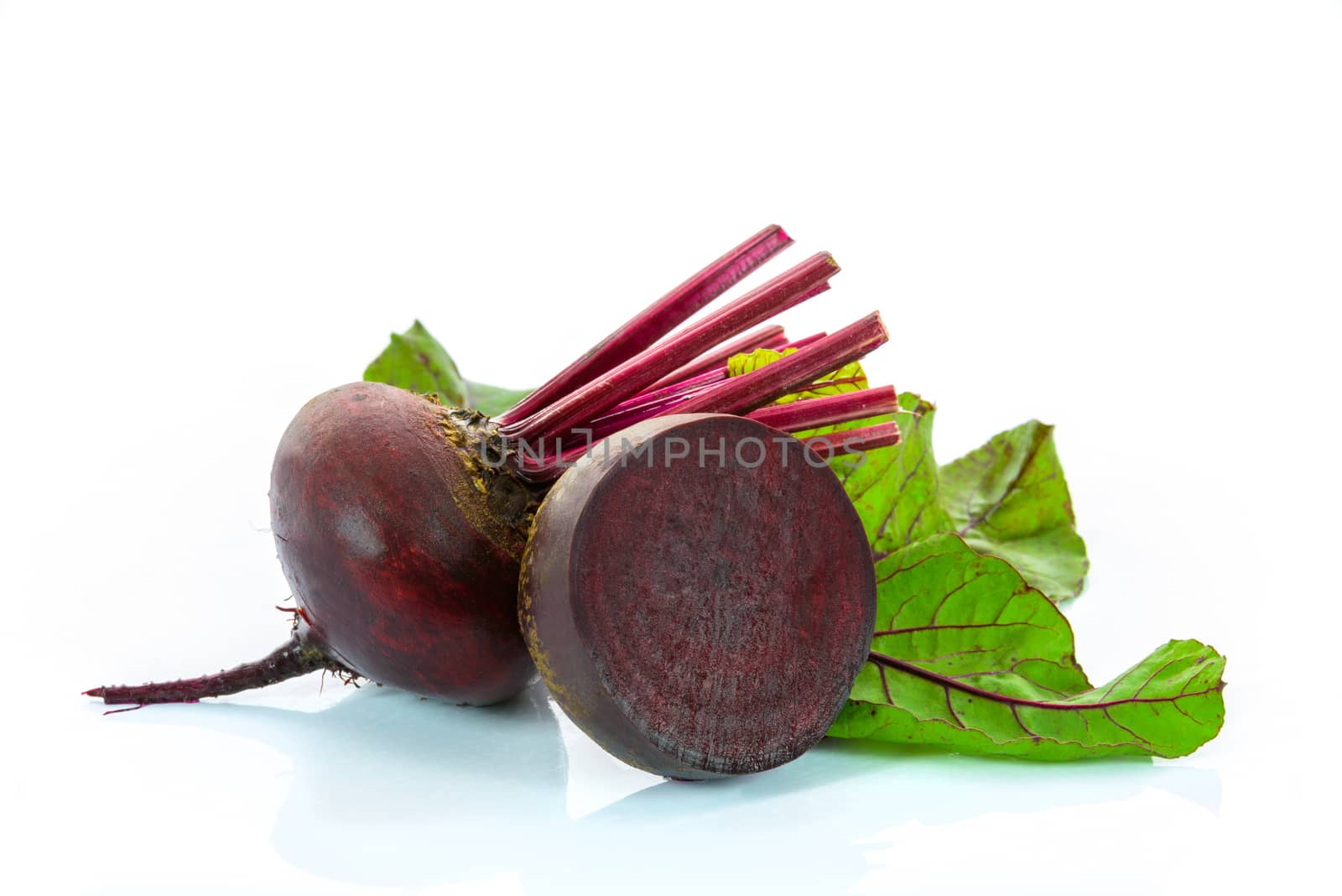 Red beets with leaves isolated on a white background