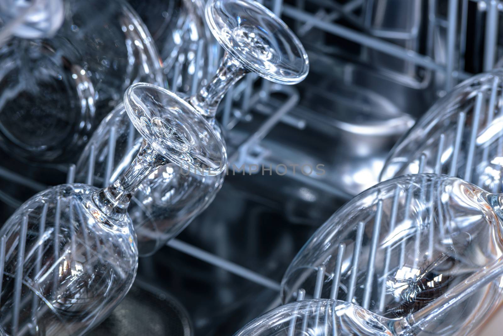 Shining glasses and dishes washed in the dishwasher