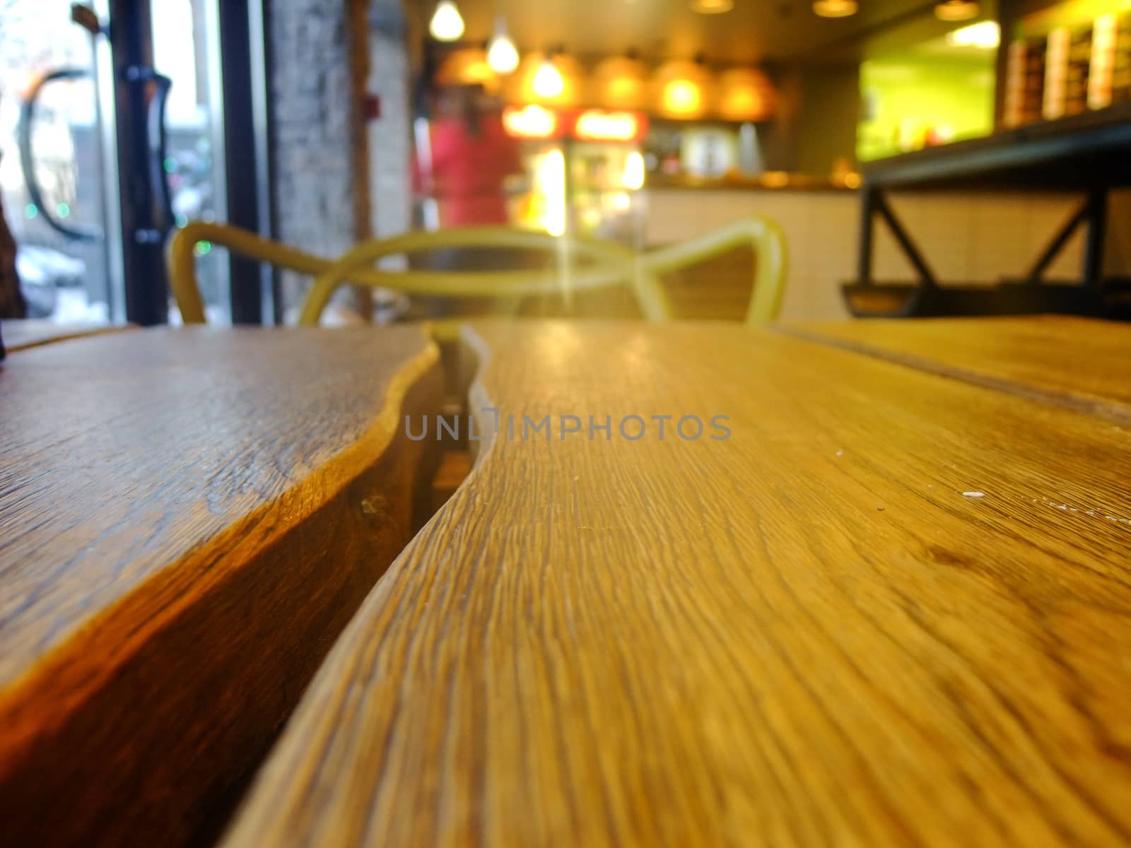 Closeup of wooden Table with Chairs in the Restaurant