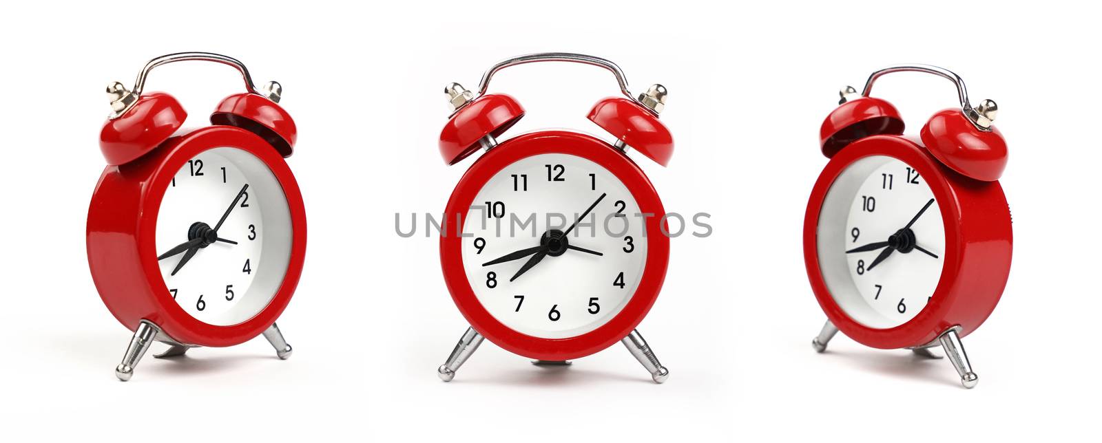 Three small red metal alarm clock with red bells over white background, close up, low angle view in different perspectives
