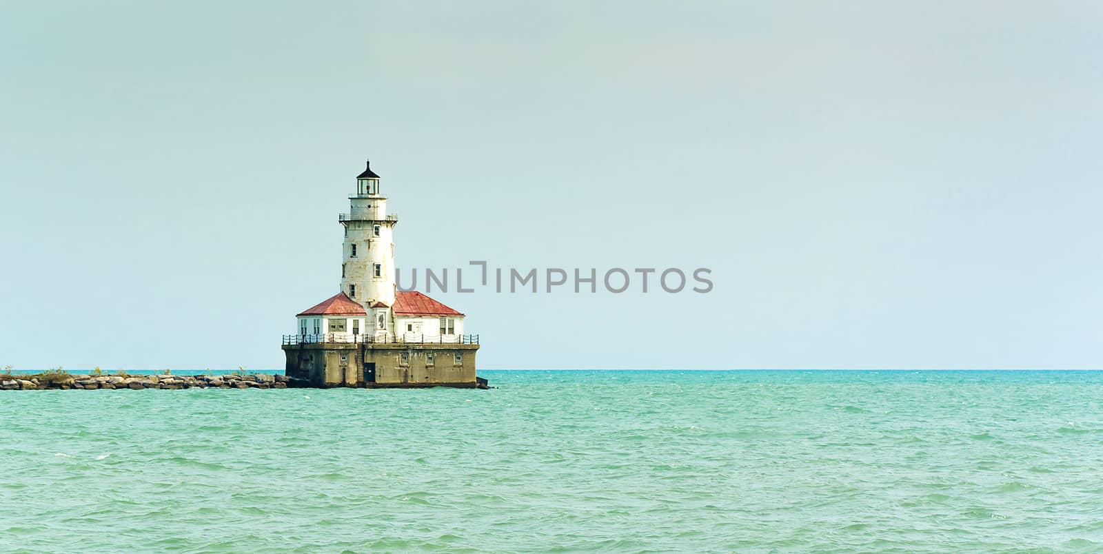 Lighthouse on a sunny day with blue sky.