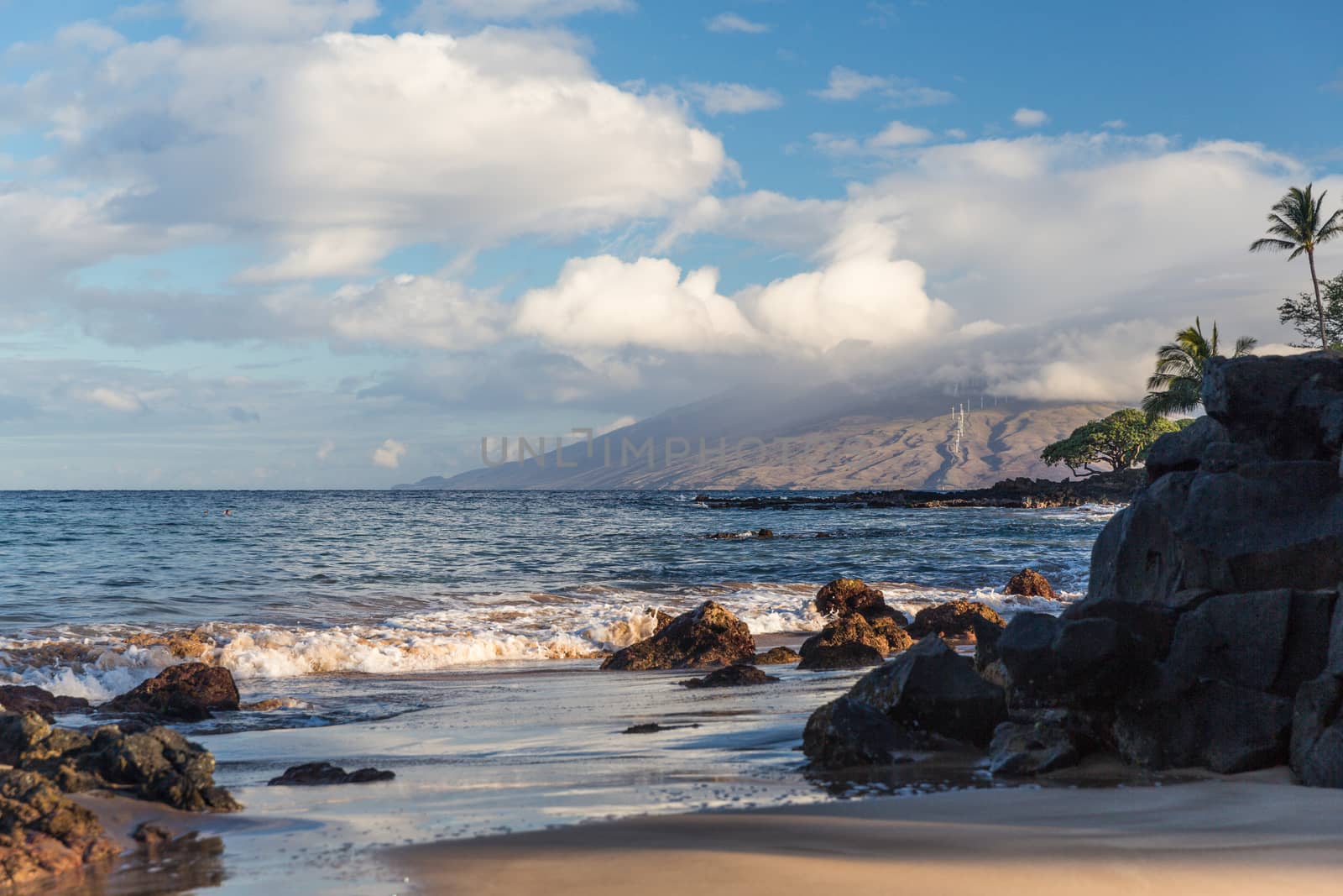 The beach and rocks in Maui Hawaii by chrisukphoto