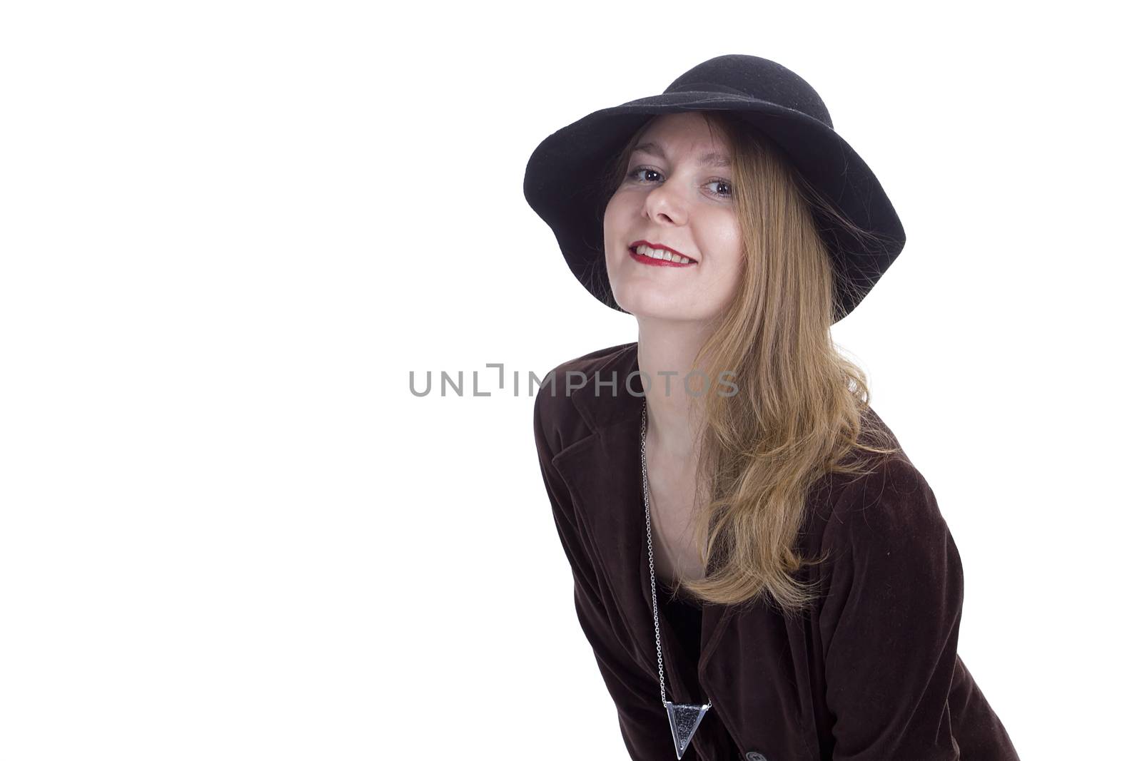 Portrait of a young woman in a hat on a white background