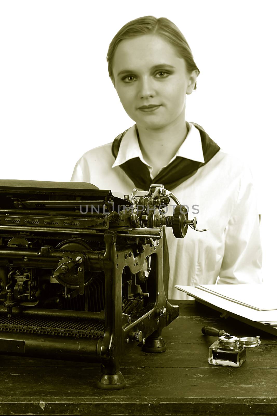 Nice girl for a vintage typewriter in a retro style on a white background