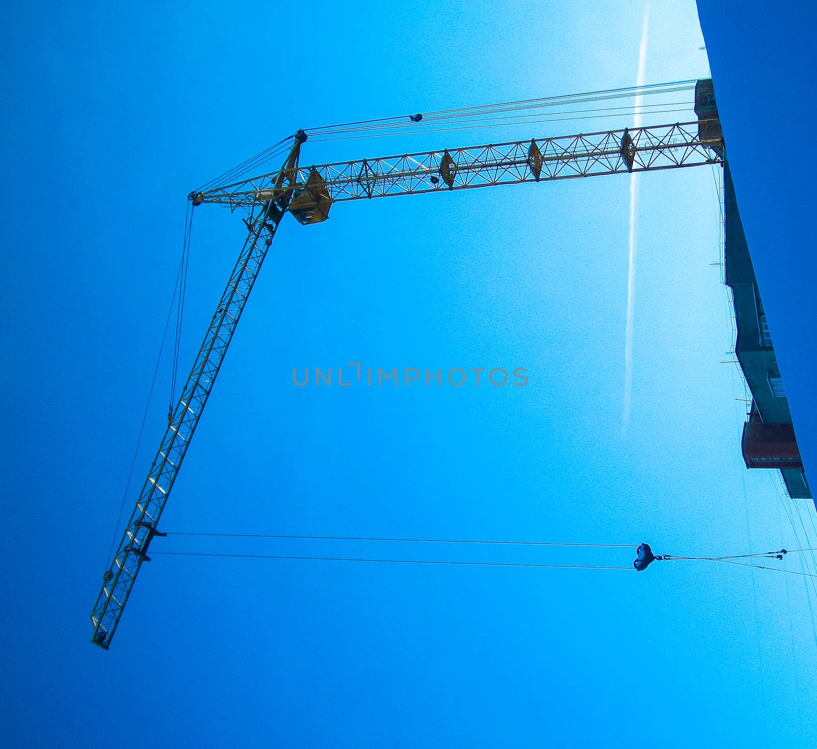 In winter the construction work of a crane