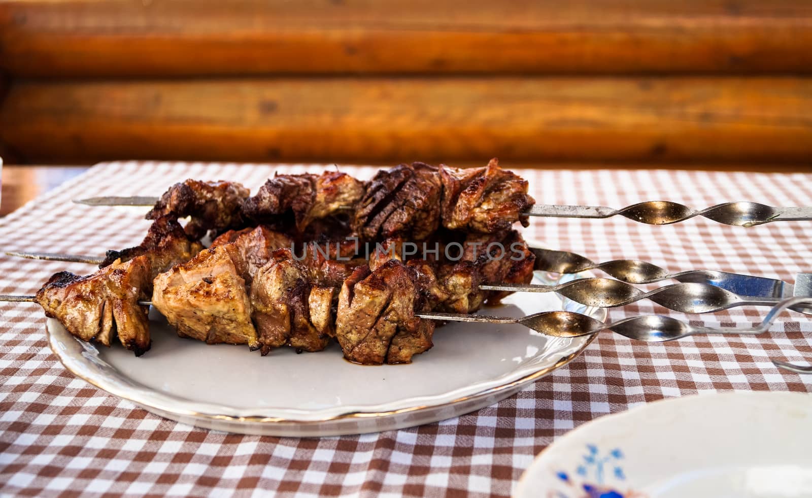 meat kebab on a plate on the table by Oleczka11