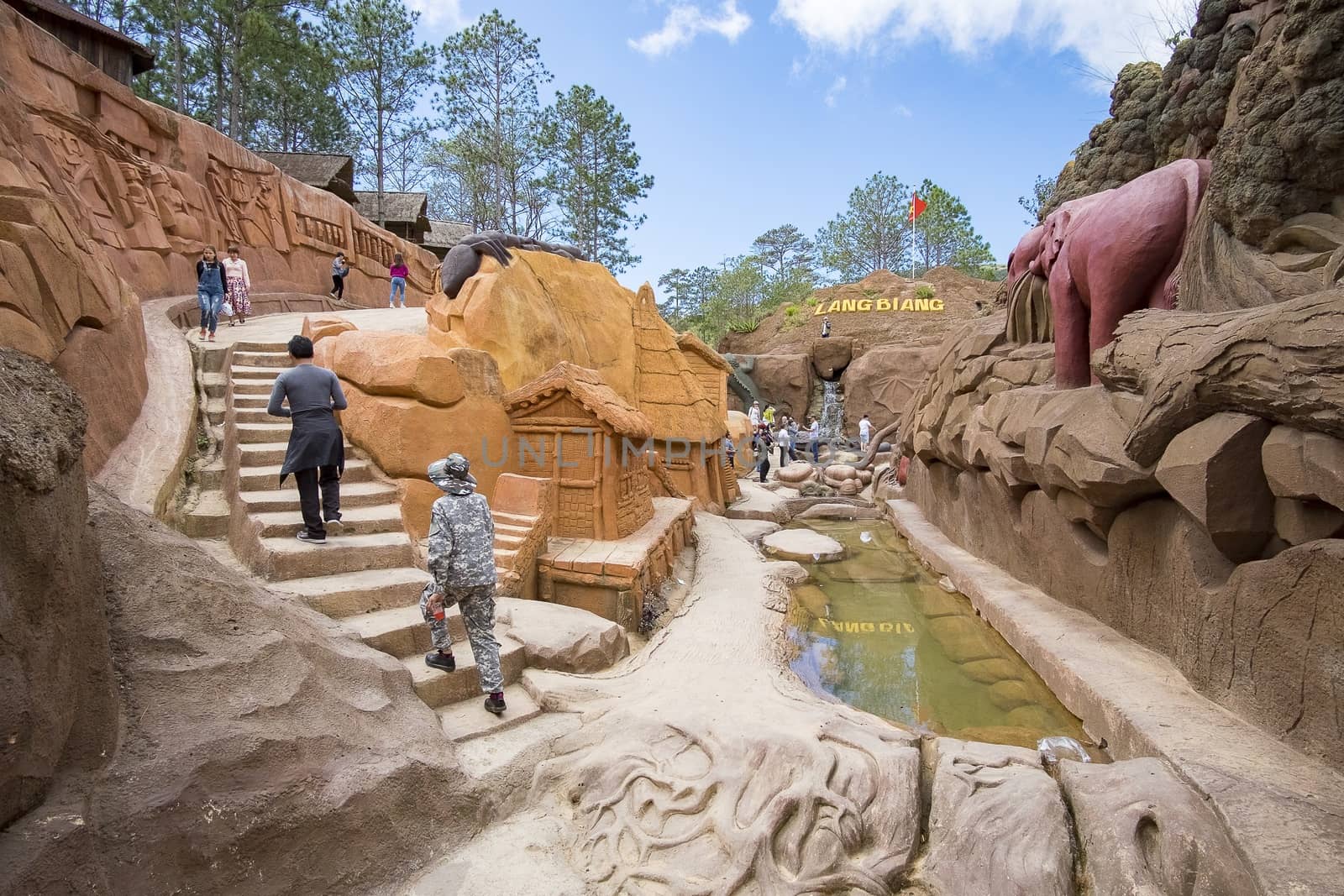 Amazing destination for Vietnam tourism, work of art know as sculpture tunnel from clay, crowd of traveller traveling architecture work in forest