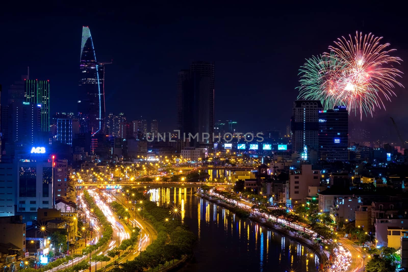 Colorful firework and night cityscape at Ho Chi Minh (SAI GON) city, VIETNAM