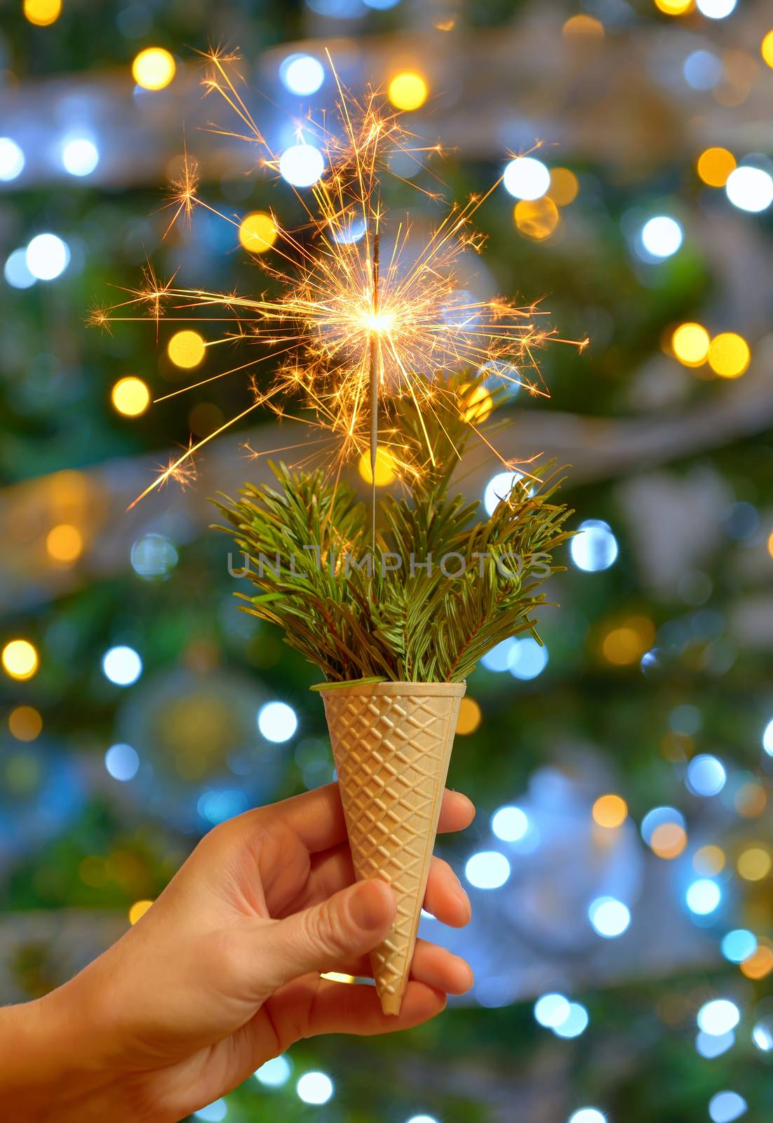 Bright festive Christmas sparkler in ice cream waffle