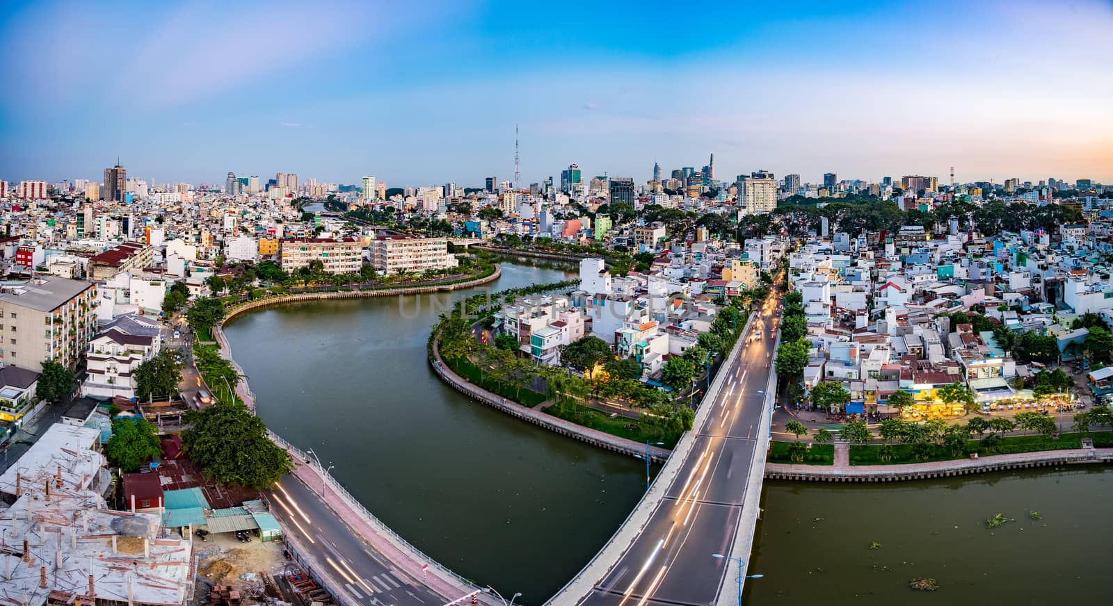 Aerial sunshine view of rooftop skyscraper on Nhieu Loc canal in Ho Chi Minh city, Vietnam
