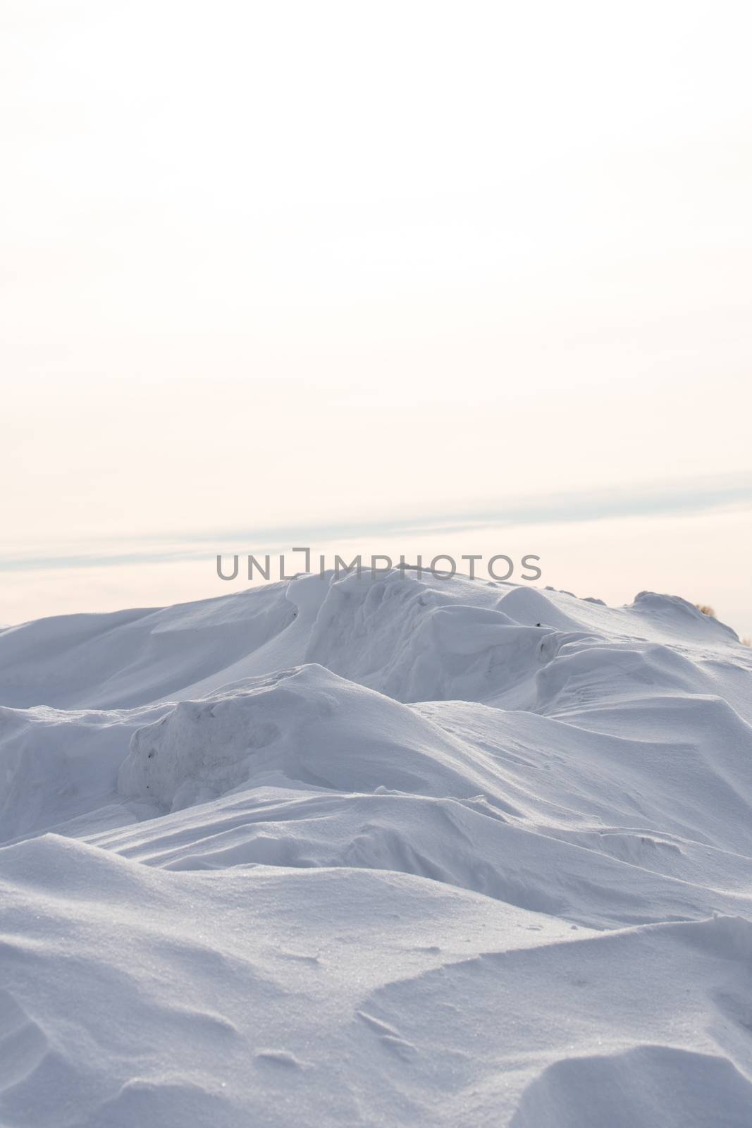 The snow isolated on white background, snow pile
