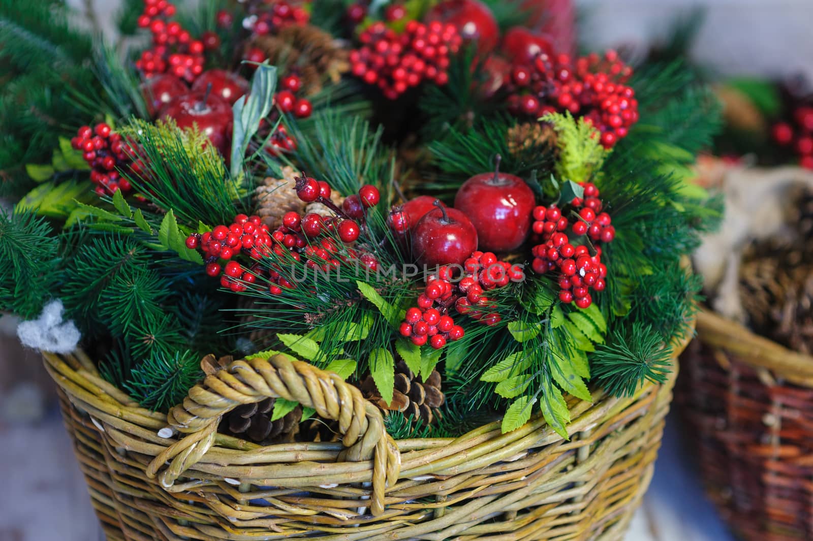Christmas Decor basket with fir branches and red apples