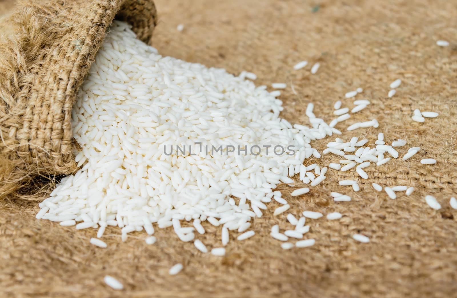 Glutinous rice in sack with hemp sacks background