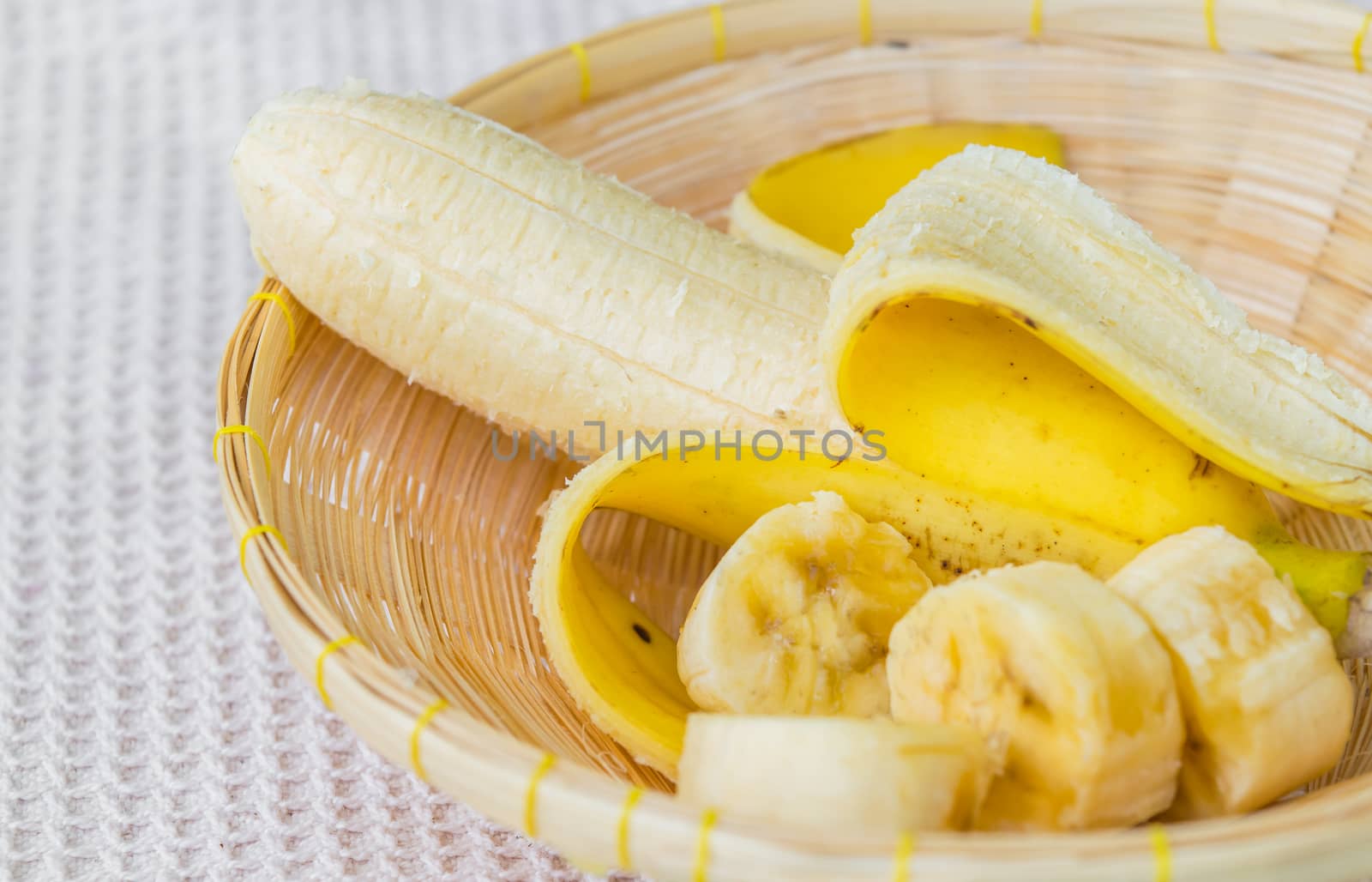 banana on bamboo basket by naramit