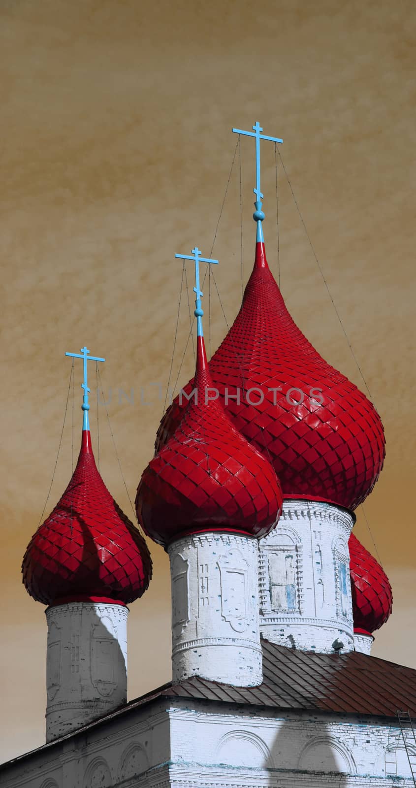 red dome on white church