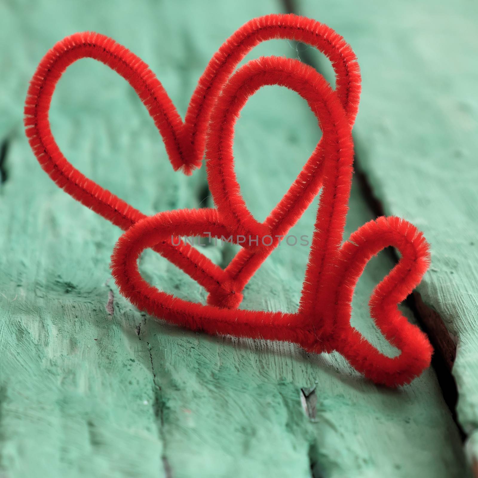 Abstract valentine background with red heart on green wooden in vintage color,  heart shape is symbol for romantic love of couple in feb 14