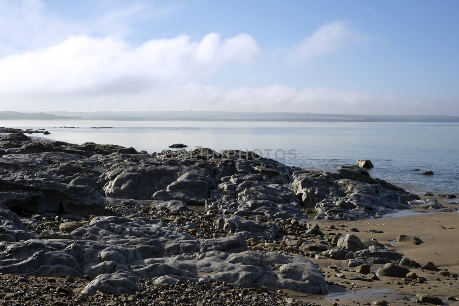 peaceful day over the black rocks by morrbyte