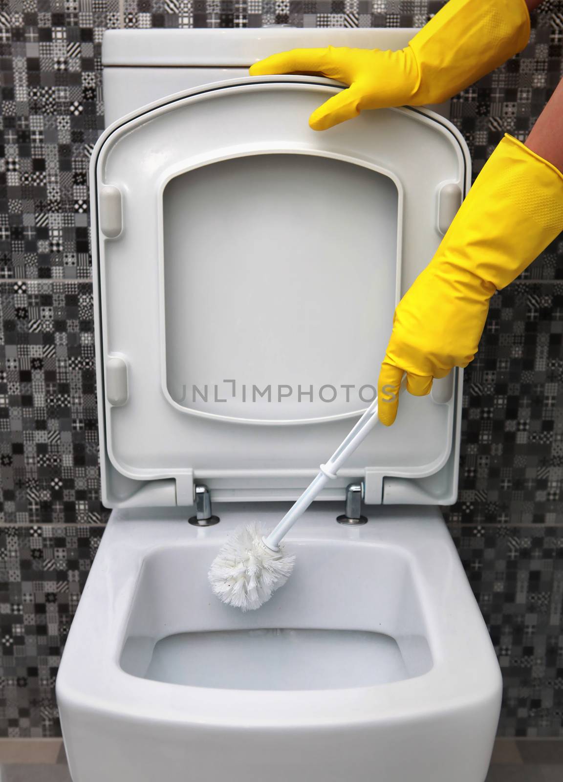 cleaning of toilet bowl by ssuaphoto